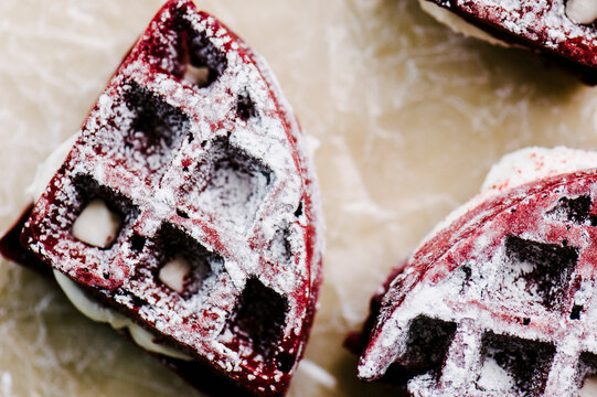 Red Velvet Cake Waffles Sandwiches On Parchement Paper