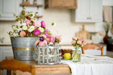 Obraz na płótnie Canvas Kitchen table with flower basket