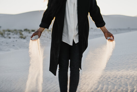 Hands holding sand