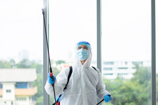 Employees  sterilize covic 19 cleaning virus on office,teamwork for cleaning meetroom