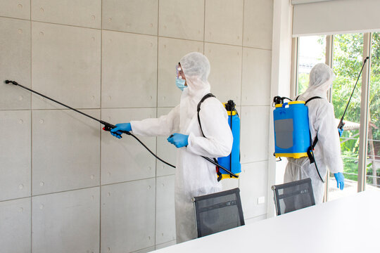 Employees  sterilize covic 19 cleaning virus on office,teamwork for cleaning meetroom