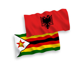 Flags of Zimbabwe and Albania on a white background