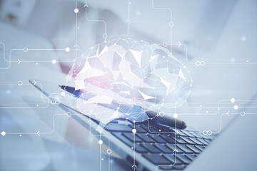 Double exposure of work space with computer and human brain drawing hologram. Brainstorm concept.