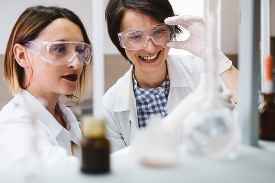 Two Female Chemist Scientists Working in the Lab