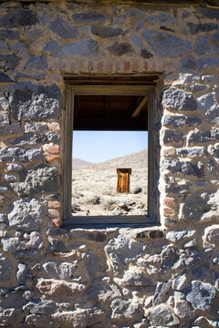 Peering Through Stone Window Frame of Ghost Town Building