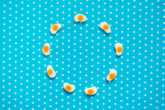 Small Fried Eggs on Blue and White Polka Dot Background