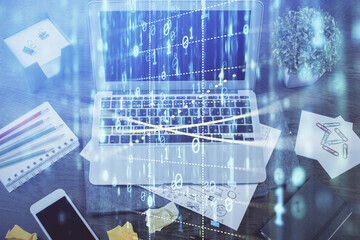 Double exposure of laptop computer and technology theme hologram. Concept of freelance work.