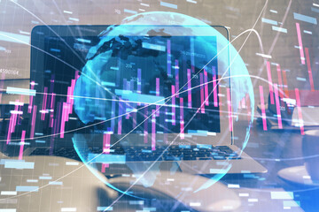 Financial graph colorful drawing and table with computer on background. Double exposure. Concept of international markets.