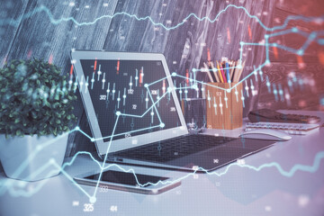 Double exposure of forex chart and work space with computer. Concept of international online trading.