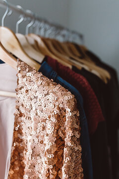 Sequin pink jacket hanging on clothing rack