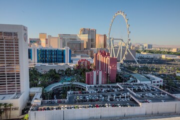 Clear desert morning view of resort casino towers and the High Roller ferris wheel attraction. 