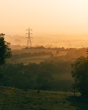 Power Lines in rural land at Sunset