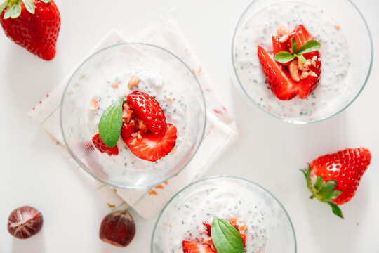 Chia yogurt with strawberries and hazelnuts