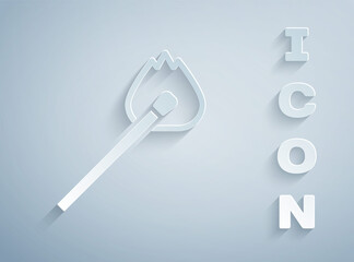 Paper cut Burning match with fire icon isolated on grey background. Match with fire. Matches sign. Paper art style. Vector.