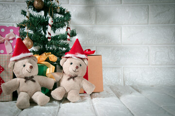 couple bear at silent night with Christmas tree and ornament, light up glitter background. Merry christmas and happy new year night.