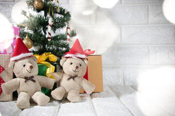 couple bear at silent night with Christmas tree and ornament, light up glitter background. Merry christmas and happy new year night.