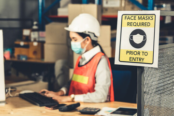 Caution sign in factory warning to industry labor worker to prevent Covid-19 Coronavirus spreading...