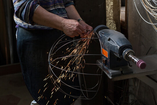 Artisan at Work in his Workshop making lampshades.