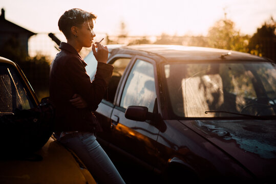 Young attractive woman smoking a cigarette