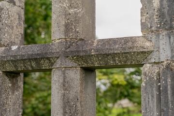 Aughnanure Castle, Oughterard, County Galway, Ireland. Looking through the ornate stone window of this well preserved medieval structure which is a popular historical tourist attraction.