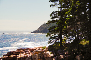 Ocean surf and wash on rocky coast line of Acadia National Park, a popular cruise tour nature...