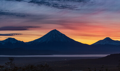 Fototapeta na wymiar Kamchatka, sunrise over the Koryaksky and Avachinsky volcanoes