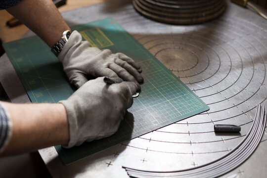 Artisan at Work in his Workshop making lampshades.
