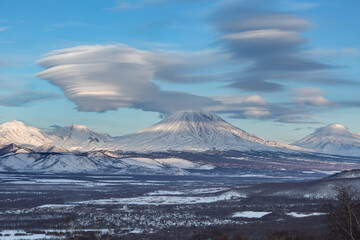 Fototapeta na wymiar Kamchatka, the invasion of lenticular clouds over the Koryaksky volcano