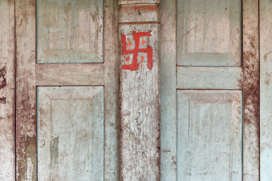Swastika painted on a wooden door