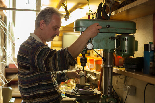 Artisan at Work in his Workshop making lampshades.