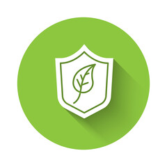 White Shield with leaf icon isolated with long shadow. Eco-friendly security shield with leaf. Green circle button. Vector.