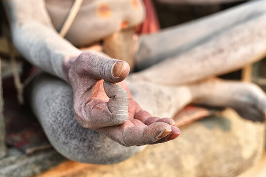 Detail of a sadhu's hand praying on a temple