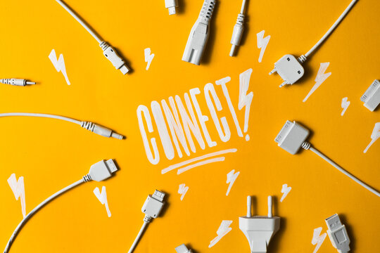 Various cable jacks and plugs on orange background with word ""Connect"".