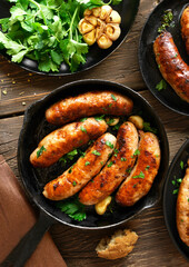 Roasted sausages in frying pan