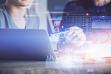 Multi exposure of data internet theme hologram with man working on computer on background. Concept...