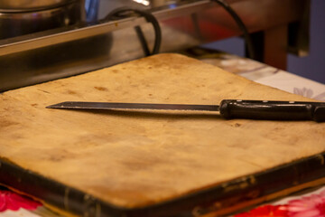 front view knife on wooden cutting board