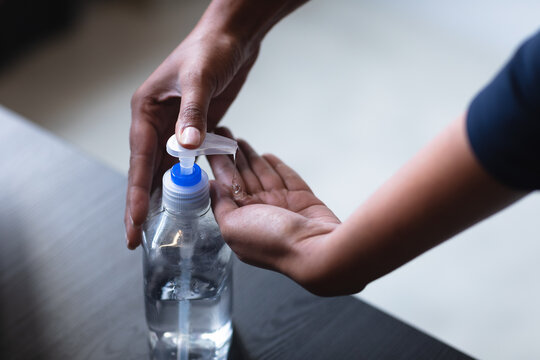 Close up of woman sanitizing her hands