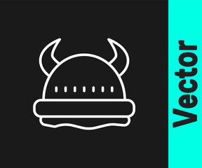 White line Viking in horned helmet icon isolated on black background. Vector.