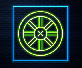 Glowing neon line Old wooden wheel icon isolated on brick wall background. Vector.