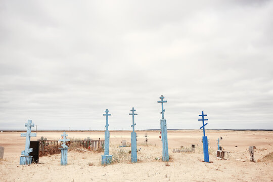 grave crosses in a desert cemetery / climate change concept warming, disaster, apocalypse, Christian cemetery
