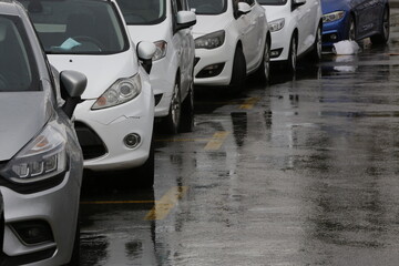 Cars parked on a rainy day