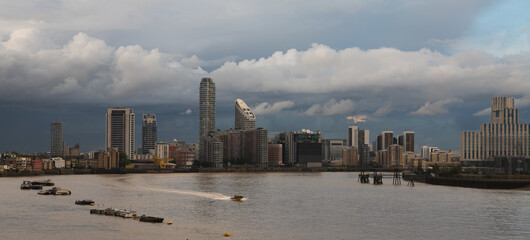 Cityscape of the Skyscrapers in the city of London financial district, by the River Thames on a cloudy day in summer