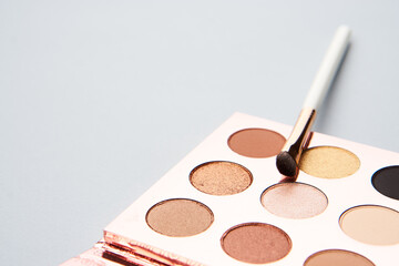 makeup brushes eyeshadow collection professional cosmetics on gray background