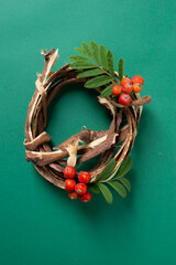 autumn wreath on green background