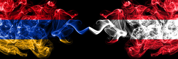 Armenia vs Austria, Austrian smoky mystic flags placed side by side. Thick colored silky abstract smoke flags