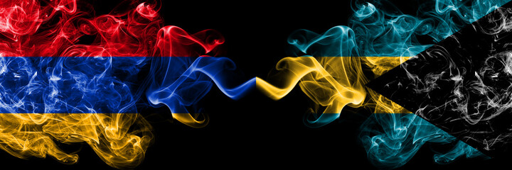 Armenia vs Bahamas, Bahamian smoky mystic flags placed side by side. Thick colored silky abstract smoke flags