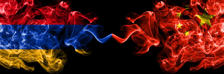 Armenia vs China, Chinese smoky mystic flags placed side by side. Thick colored silky abstract smoke flags