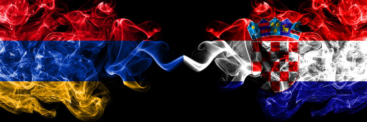 Armenia vs Croatia, Croatian smoky mystic flags placed side by side. Thick colored silky abstract smoke flags