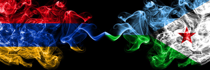 Armenia vs Djibouti smoky mystic flags placed side by side. Thick colored silky abstract smoke flags