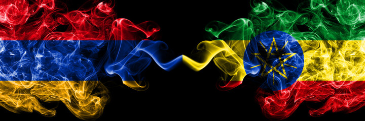 Armenia vs Ethiopia, Ethiopian smoky mystic flags placed side by side. Thick colored silky abstract smoke flags